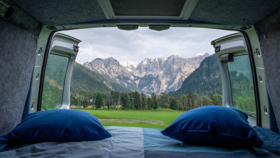 comfortable blue pillows in a camper van