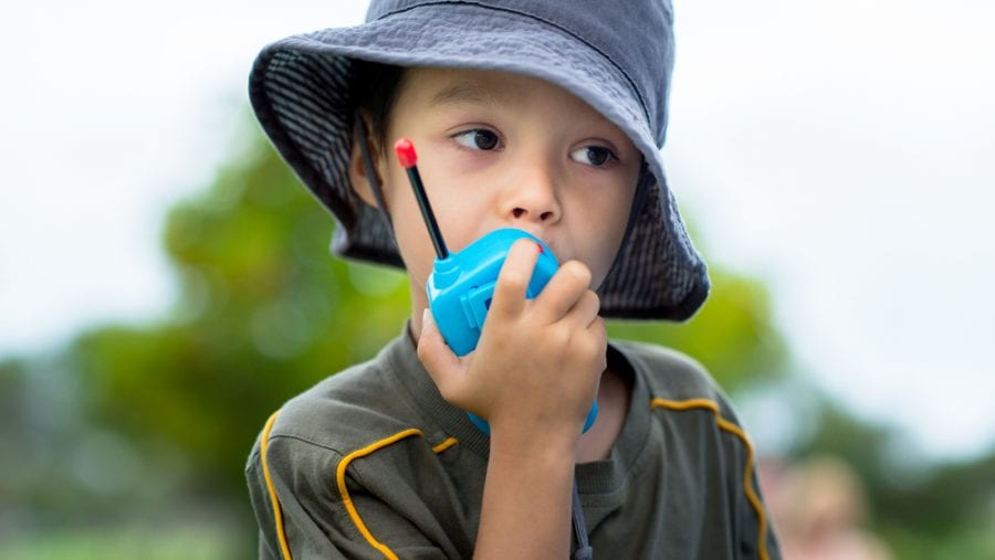 kid with a blue walkie talkie