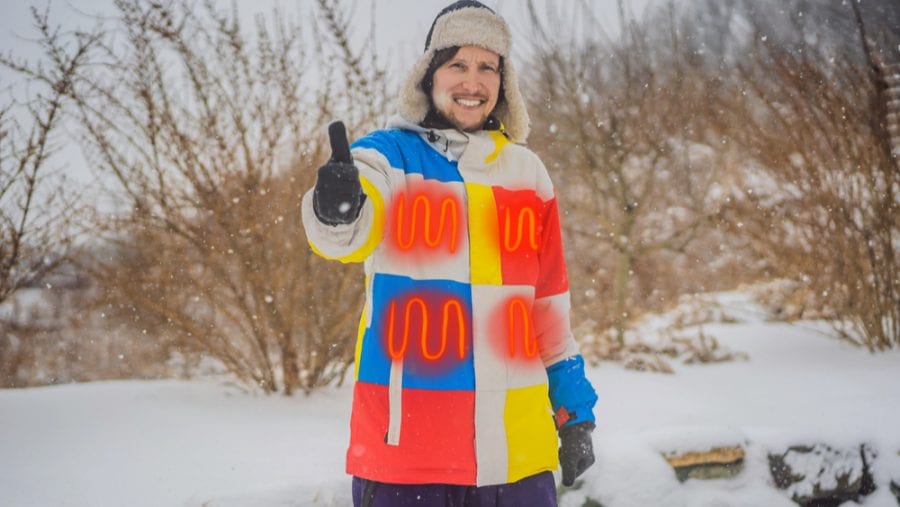man showing off his heated winter jacket