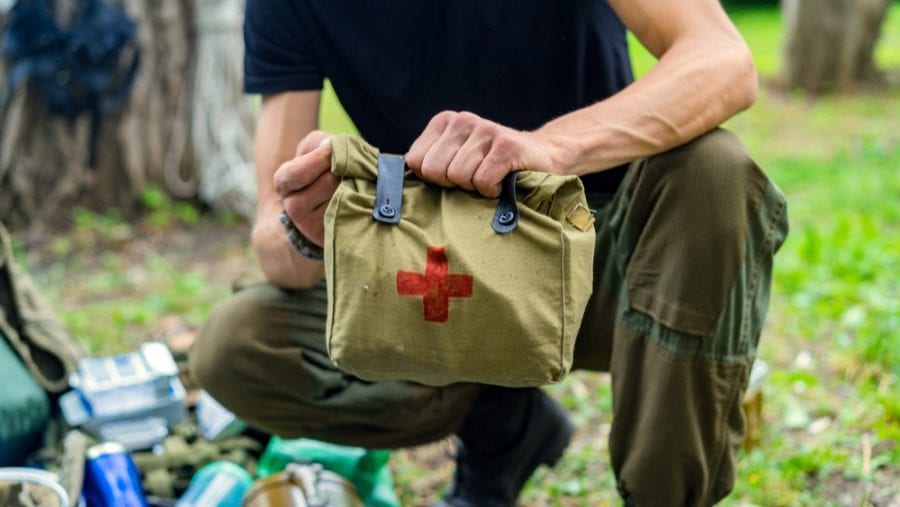 man with first aid kit on hand