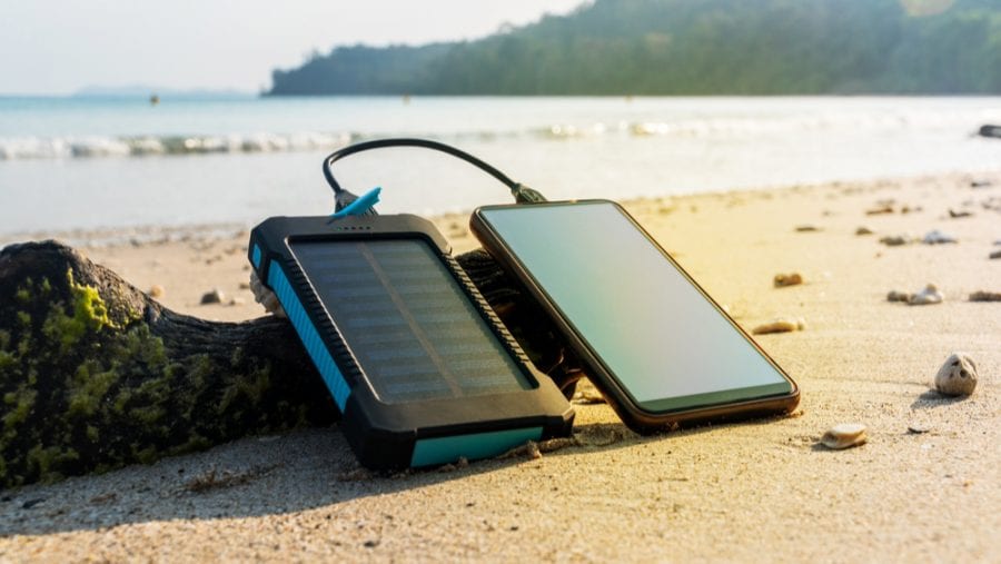 portable solar panel charging a cellphone