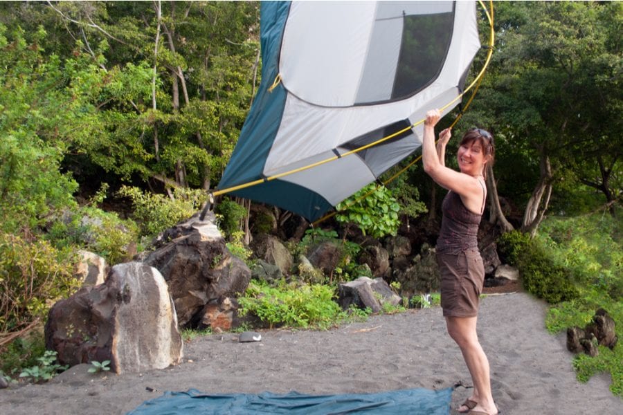 woman carrying a lightweight 2 person tent